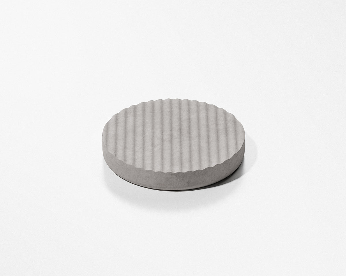 FORMED Wave Round sculptural concrete tray in a contemporary bathroom