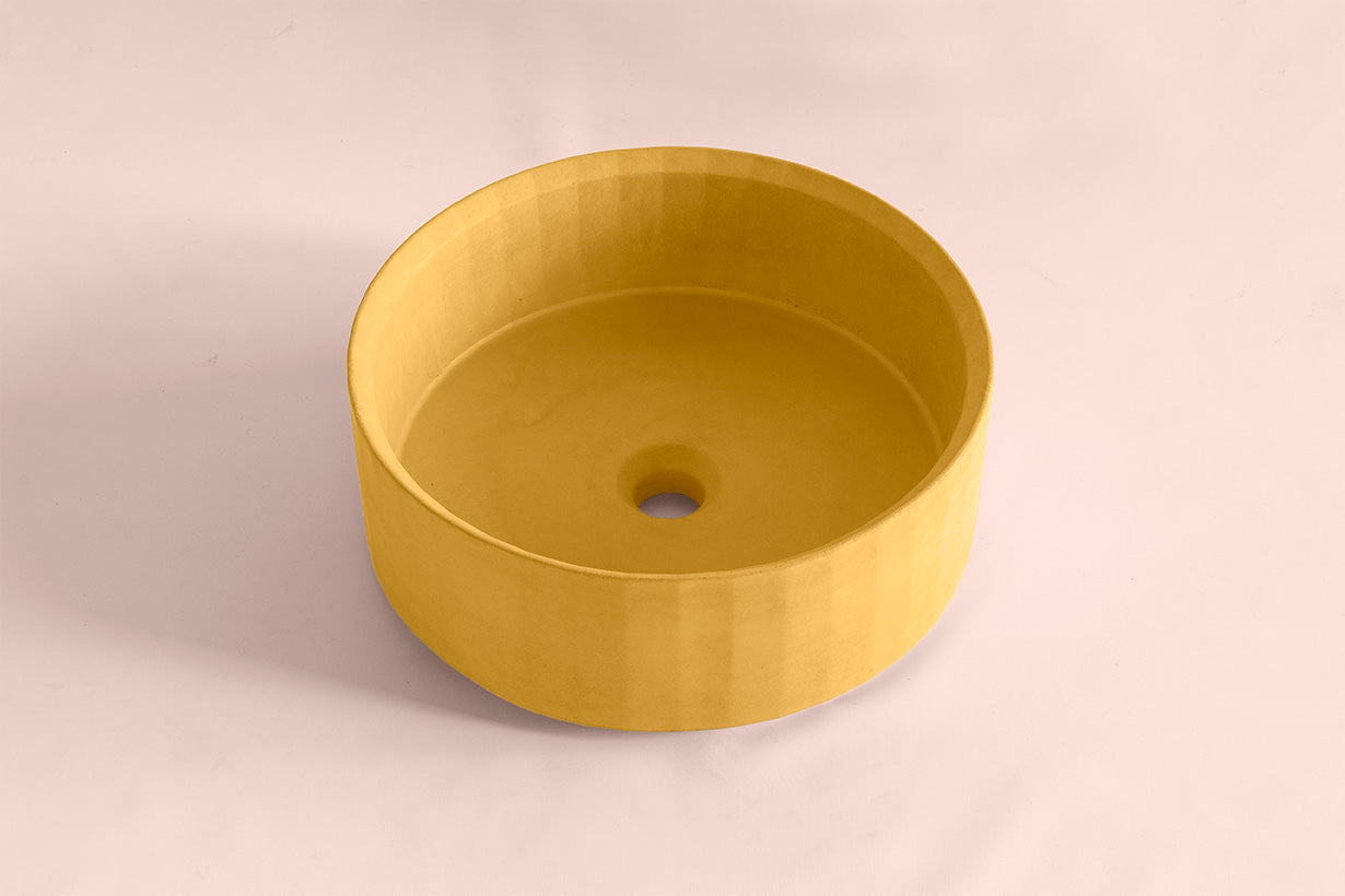 Facet sculptural concrete bowl basin with geometric faceted surface