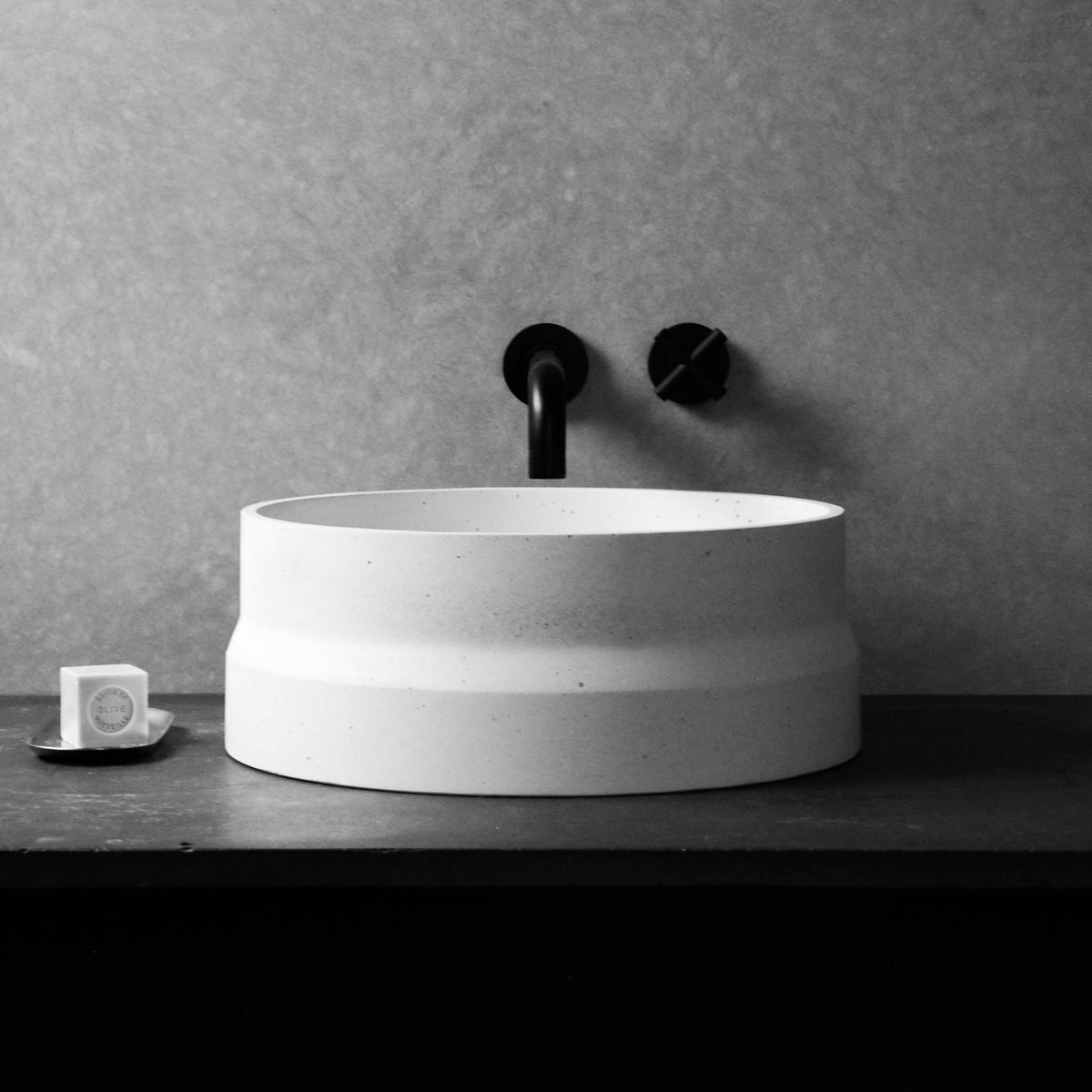Nira round concrete bathroom basin with angled industrial form